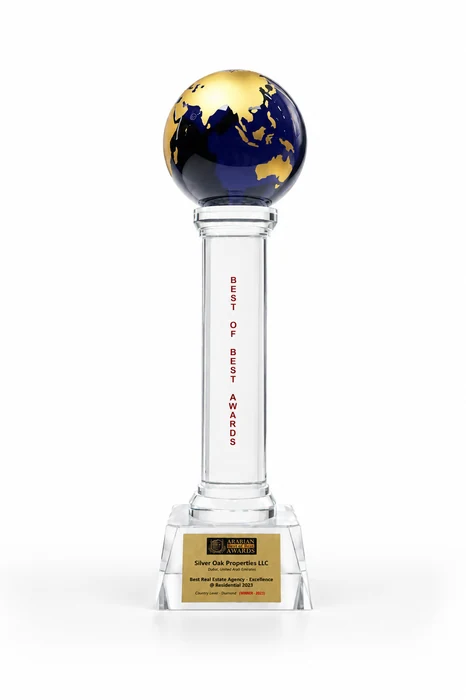 Best of Best Awards trophy, a gold and blue globe on a crystal column, plaque engraved SILVER OAK PROPERTIES LLC